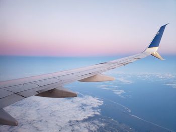 Cropped image of airplane wing