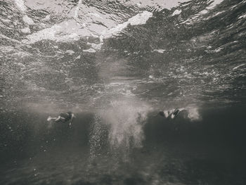 People swimming in sea