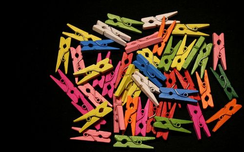 Close-up of colorful toys over black background