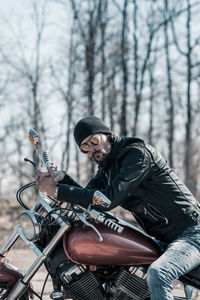 Midsection of man riding motorcycle