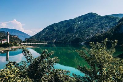 Scenic view of lake and mountains against sky