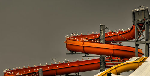 Low angle view of illuminated ship against sky