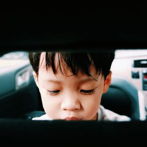 Portrait of boy in car