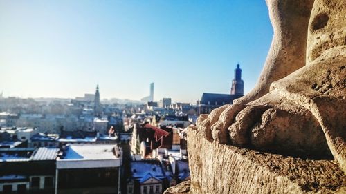 Cityscape against clear blue sky