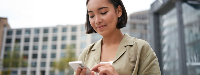 Businesswoman using mobile phone