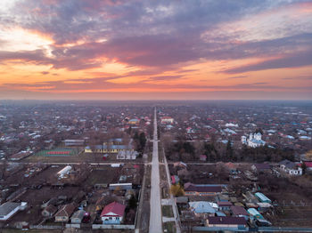 High angle view of buildings against sky during sunset