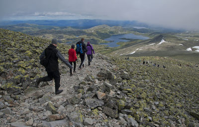 Hikers moving down on mountain