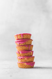 Stack of cake on table against white background