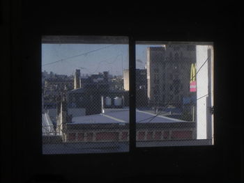 Buildings seen through glass window