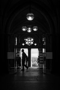 Man walking in illuminated building
