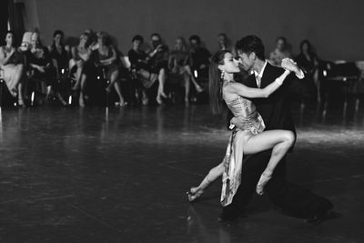 Audience looking at dancers performing on stage