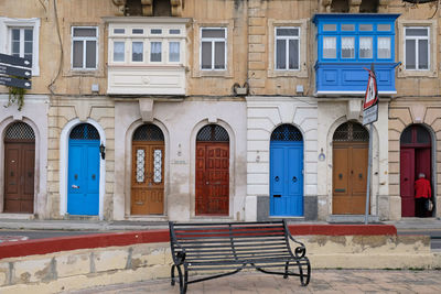 Traditional vintage painted wooden door and exterior in malta. entrance to typical maltese houses.