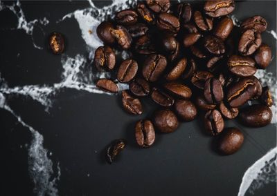 High angle view of roasted coffee beans on table