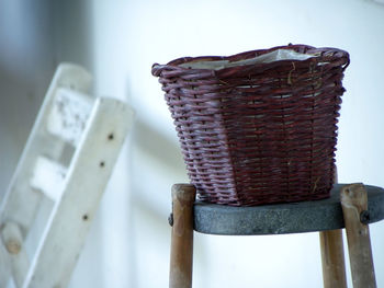 Close-up of whicker basket on table