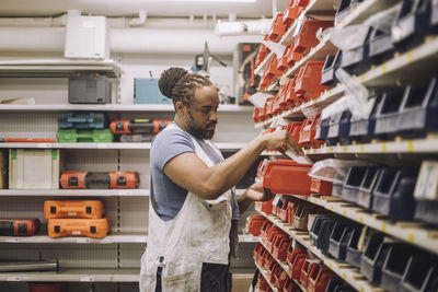 Midsection of woman standing in store