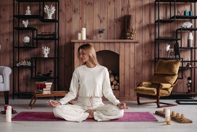 Woman sitting on wood at home