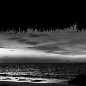 View of calm sea against cloudy sky