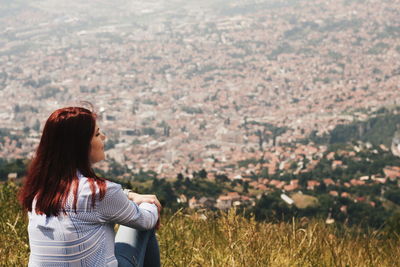 Woman looking at cityscape