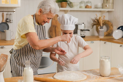 Close-up of chef preparing food in kitchen