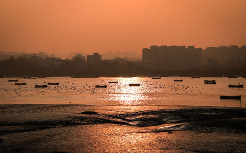 Scenic view of sea against sky during sunset