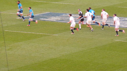 People running on soccer landscape