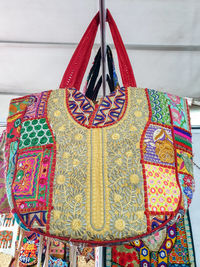 Close-up of multi colored decoration hanging against wall