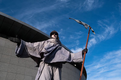 Low angle view of statue against sky