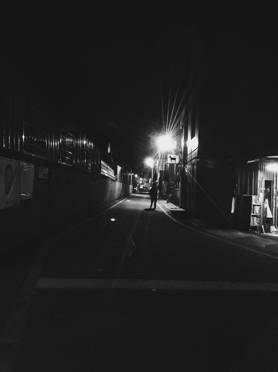 transportation, illuminated, mode of transport, night, land vehicle, the way forward, car, road, diminishing perspective, built structure, travel, architecture, incidental people, street, vanishing point, road marking, city, on the move, street light, city life