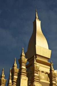 Low angle view of statue against cloudy sky