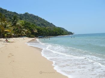 Scenic view of beach against clear sky