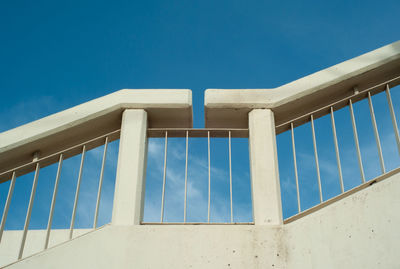 Low angle view of bridge against clear blue sky