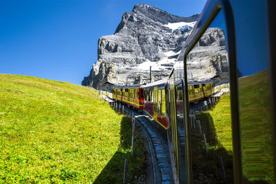 Train on field against sky