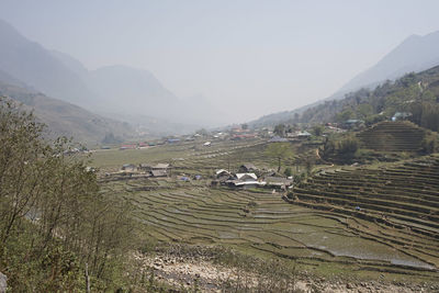 Scenic view of landscape and mountains against sky