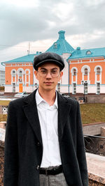 Portrait of young man standing outdoors