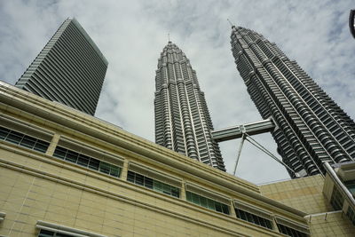 Low angle view of skyscrapers against sky