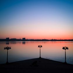 Scenic view of lake against sky during sunset