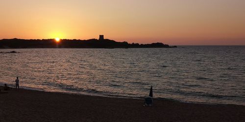 Scenic view of sea against clear sky during sunset