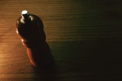 High angle view of woman hand on illuminated table