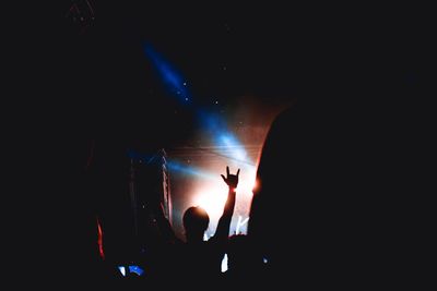 Silhouette people at music concert