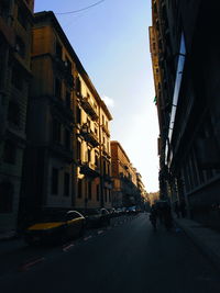 City street amidst buildings against sky