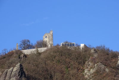 Low angle view of building against blue sky