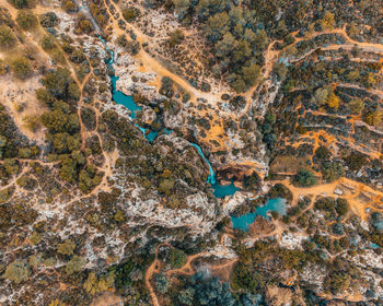 High angle view of water flowing through rocks