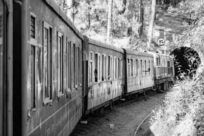 Kalka shimla toy train moving on mountain slope, beautiful view, one side mountain and valley