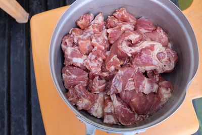 High angle view of meat in container on table