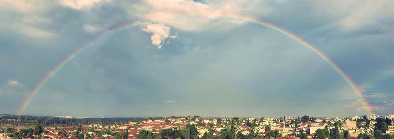 Rainbow over city