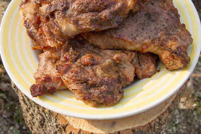 High angle view of meat in plate on table