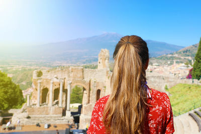 Rear view of woman looking at castle