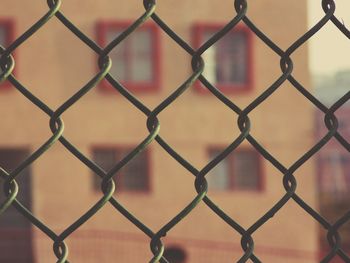 Full frame shot of chainlink fence against sky