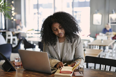 Woman working in cafe