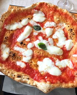 Close-up of pizza served on table